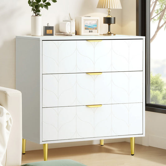 White dresser with gold legs in a room setting