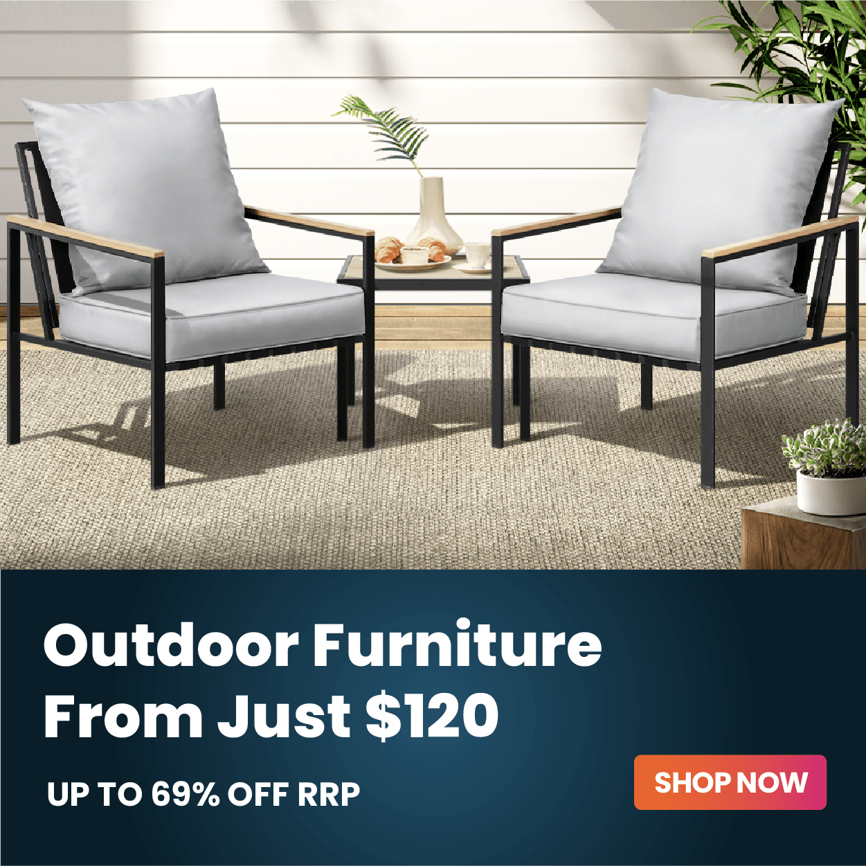 Two outdoor patio armchairs with light gray cushions and black metal frames, shown beside a small side table on a woven rug. A dark promotional banner at the bottom reads 'Outdoor Furniture From Just $120 UP TO 69% OFF RRP' with a 'SHOP NOW' button.