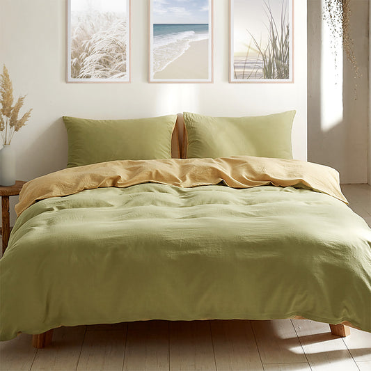 A double washed cotton quilt set in yellow and lime green colors, displayed on a bed with a decorative background.