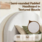 Semi-rounded padded headboard with textured boucle finish, featuring text and icons indicating features.