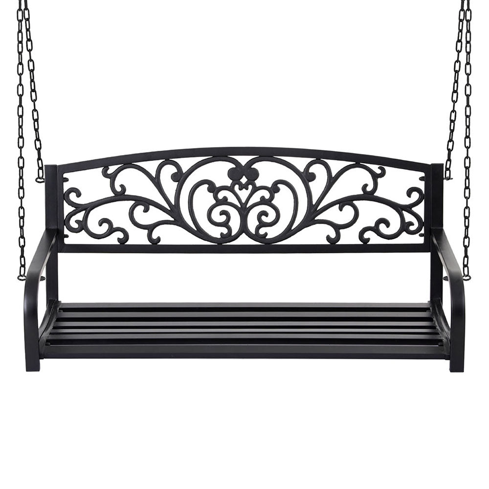 Decorative black metal swing with intricate designs on a white background