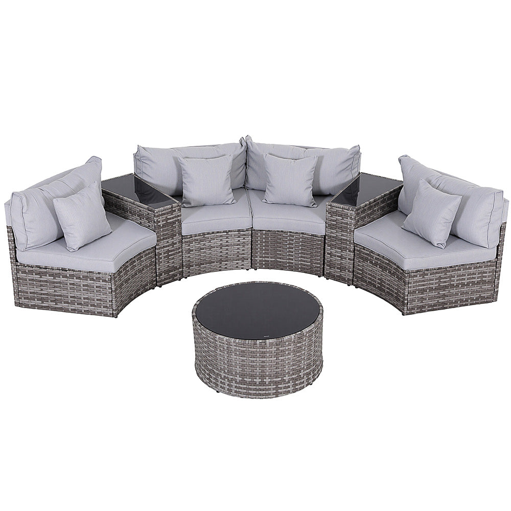 Outdoor patio furniture set with cushions on a white background
