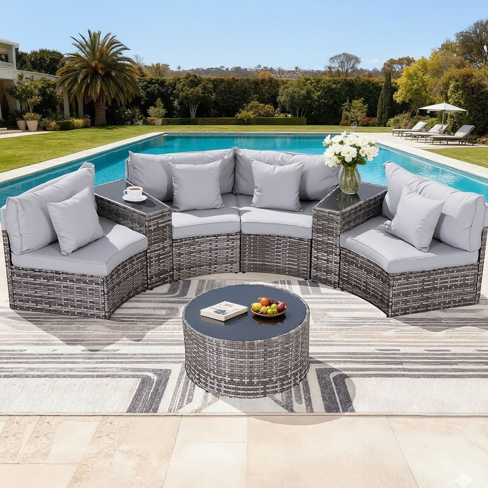 Outdoor patio furniture set with cushions by a pool