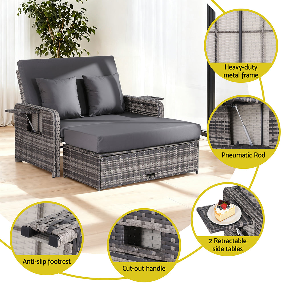 Outdoor sofa with gray cushions, featuring various components on a white background.