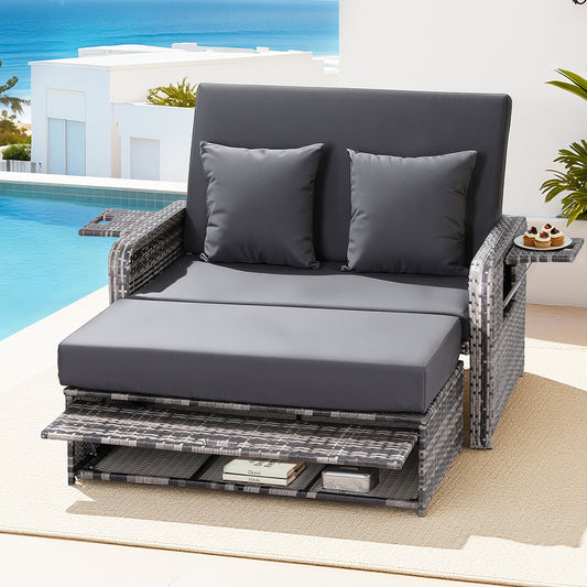 Gray outdoor lounge chair with cushions by a poolside.