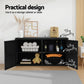 Black storage cabinet with open doors displaying various items in a room setting.