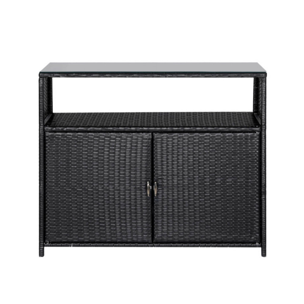 Black wicker sideboard with glass top on a white background