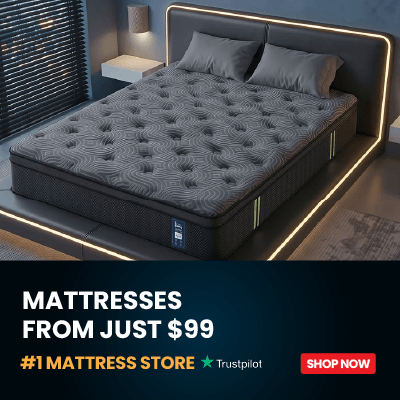 A dark gray tufted mattress shown on a bed in a modern bedroom setting with LED lighting around the bed frame. A dark blue banner at the bottom reads 'MATTRESSES FROM JUST $99', '#1 MATTRESS STORE Trustpilot', and 'SHOP NOW'.