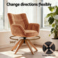 Maren Velvet Swivel Armchair in brown with 360-degree rotation and sturdy metal base, placed in a bright room with indoor plants.