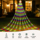 Decorative outdoor Christmas tree made of colorful lights in front of a house.