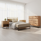 Melrose Queen Bedroom Suite with oak tallboy, two oak bedside tables, queen metal bed frame and mattress in modern sunlit room.